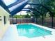 Relaxing screened-in pool with a spacious deck at 6854 Circlecreek Dr, Pinellas Park, FL 33781