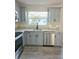 Updated kitchen with stainless steel appliances and granite countertops at 1638 Polo Club Dr, Tarpon Springs, FL 34689