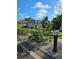 Landscaped yard with tropical plants and mailbox at 1638 Polo Club Dr, Tarpon Springs, FL 34689
