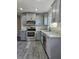 Modern kitchen with stainless steel appliances and granite countertops at 1638 Polo Club Dr, Tarpon Springs, FL 34689