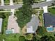 Two houses with pools from an aerial perspective at 1638 Polo Club Dr, Tarpon Springs, FL 34689