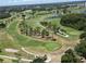 Aerial view of a lush green golf course at 1638 Polo Club Dr, Tarpon Springs, FL 34689