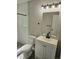 Clean bathroom with white subway tiles, vanity, and toilet at 1638 Polo Club Dr, Tarpon Springs, FL 34689