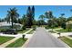 Residential street with lush landscaping and homes at 1638 Polo Club Dr, Tarpon Springs, FL 34689