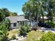 Single-story home with lush landscaping at 1638 Polo Club Dr, Tarpon Springs, FL 34689