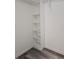 White built-in shelving unit inside a spacious closet at 1638 Polo Club Dr, Tarpon Springs, FL 34689