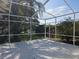 Relaxing screened patio overlooking a pond at 1638 Polo Club Dr, Tarpon Springs, FL 34689
