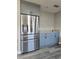 Stainless steel refrigerator with french doors and ice maker in updated kitchen at 1638 Polo Club Dr, Tarpon Springs, FL 34689