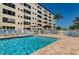 Inviting community pool with lounge chairs at 2850 59Th S St # 204, Gulfport, FL 33707