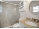 Modern bathroom with marble shower and granite vanity at 910 Spindle Palm Way, Apollo Beach, FL 33572