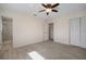 Spacious bedroom with wood-look flooring and private bath access at 910 Spindle Palm Way, Apollo Beach, FL 33572