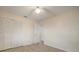 Bedroom with wood-look floors and double door closet at 910 Spindle Palm Way, Apollo Beach, FL 33572