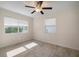 Bright bedroom with ceiling fan and wood-look flooring at 910 Spindle Palm Way, Apollo Beach, FL 33572