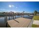 Private dock with composite decking overlooking the canal at 910 Spindle Palm Way, Apollo Beach, FL 33572