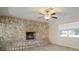 Stone fireplace with built-in seating in the living room at 910 Spindle Palm Way, Apollo Beach, FL 33572
