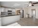Modern kitchen with stainless steel appliances and granite counters at 910 Spindle Palm Way, Apollo Beach, FL 33572