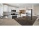 Kitchen with granite countertops and white cabinets at 910 Spindle Palm Way, Apollo Beach, FL 33572