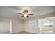 Living room with hardwood floors and open concept to kitchen at 910 Spindle Palm Way, Apollo Beach, FL 33572
