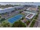 Aerial view showing tennis court, shuffleboard, and kayaks at 2850 59Th S St # 204, Gulfport, FL 33707