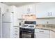Modern kitchen with granite countertops and stainless steel appliances at 2850 59Th S St # 204, Gulfport, FL 33707