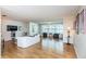 Living room featuring hardwood floors, comfortable seating, and large windows at 2850 59Th S St # 204, Gulfport, FL 33707