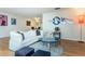 Bright living room with white couch and hardwood floors at 2850 59Th S St # 204, Gulfport, FL 33707