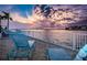 Tranquil waterfront view with seating at sunset at 2850 59Th S St # 204, Gulfport, FL 33707