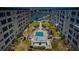 Aerial view of condo complex with pool, waterfront, and boat slips at 2850 59Th S St # 204, Gulfport, FL 33707