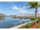 Scenic waterfront view with boats and palm trees at 2850 59Th S St # 204, Gulfport, FL 33707