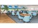 Community dining room with tables, chairs, and beach mural at 2850 59Th S St # 204, Gulfport, FL 33707
