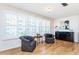Bright living room with two armchairs and wood flooring at 2850 59Th S St # 204, Gulfport, FL 33707