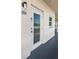 Unit entrance with a white door and security system at 2850 59Th S St # 204, Gulfport, FL 33707