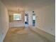 Open living and dining area with a view to the patio at 1280 Mission Cir # 45C, Clearwater, FL 33759