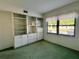 Bright bedroom with built-in shelving and window at 1280 Mission Cir # 45C, Clearwater, FL 33759