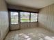 Sunroom with tiled floor and access to the outdoors at 1280 Mission Cir # 45C, Clearwater, FL 33759