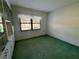 Bedroom with built-in shelving and carpet at 1280 Mission Cir # 45C, Clearwater, FL 33759