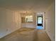 Open living and dining area with a view to the patio at 1280 Mission Cir # 45C, Clearwater, FL 33759