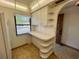 Bright kitchen features white cabinets and countertops at 1280 Mission Cir # 45C, Clearwater, FL 33759