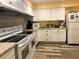 Clean and well-equipped kitchen with white cabinets at 1280 Mission Cir # 45C, Clearwater, FL 33759