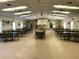 Spacious community room with tables and chairs at 1280 Mission Cir # 45C, Clearwater, FL 33759