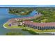 Aerial of waterfront condos with private balconies offering stunning bay views and boat docks for residents at 129 Brent Cir, Oldsmar, FL 34677