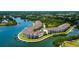Aerial view of waterfront condos with boat docks and lush greenery along the bay, amazing waterfront living at 129 Brent Cir, Oldsmar, FL 34677