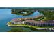 Stunning aerial view of waterfront community with docks and lush green spaces, with easy bay access at 129 Brent Cir, Oldsmar, FL 34677