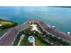 Waterfront community with pool and dock, featuring lush landscaping and stunning views of the bay at 129 Brent Cir, Oldsmar, FL 34677
