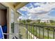 Balcony view with a beautiful canal, clear blue skies and bright green shrubbery at 129 Brent Cir, Oldsmar, FL 34677