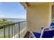 Inviting balcony with calming water views and comfortable blue lounge seating at 129 Brent Cir, Oldsmar, FL 34677