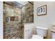Beautifully tiled walk-in shower with pebble floor and granite trim at 129 Brent Cir, Oldsmar, FL 34677