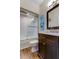 Bathroom with shower, tub, wood floors and charming nautical decor at 129 Brent Cir, Oldsmar, FL 34677