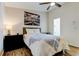 Comfortable bedroom featuring ceiling fan and ensuite bathroom at 129 Brent Cir, Oldsmar, FL 34677