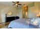 Bright bedroom features stylish decor, a comfortable bed, and a modern ceiling fan at 129 Brent Cir, Oldsmar, FL 34677
